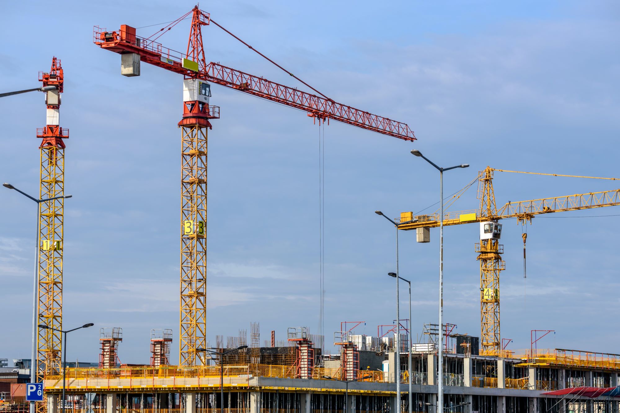 Construction site with three cranes