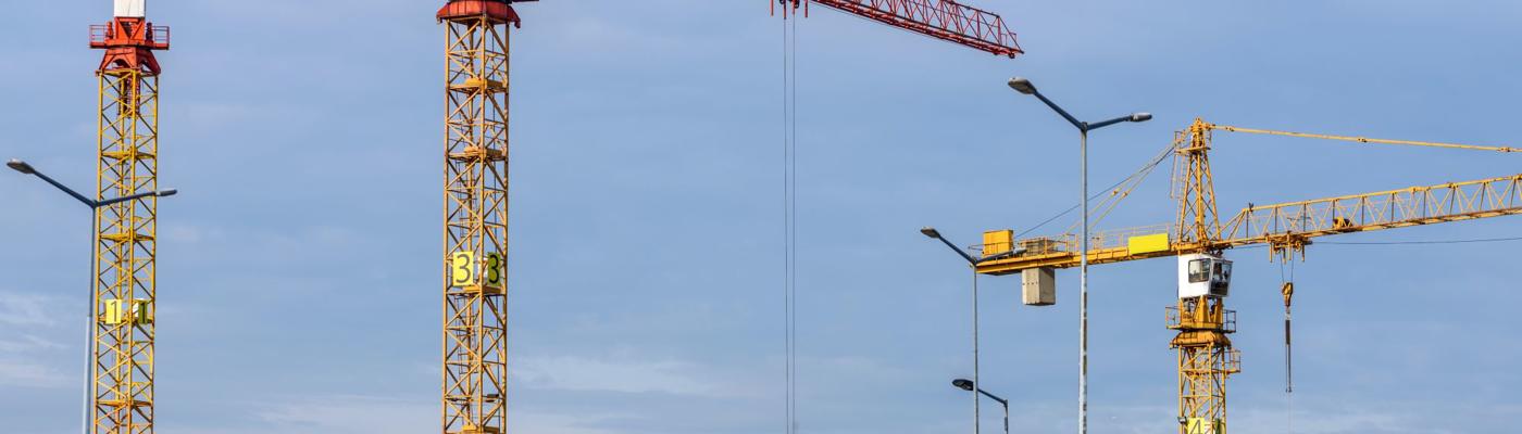 Construction site with three cranes