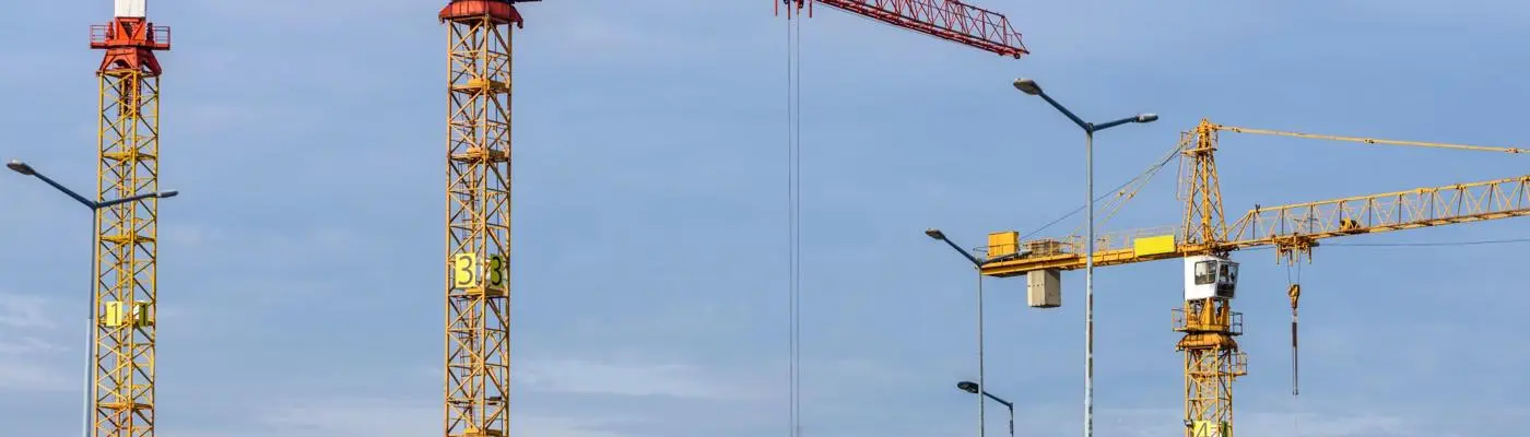 Construction site with three cranes